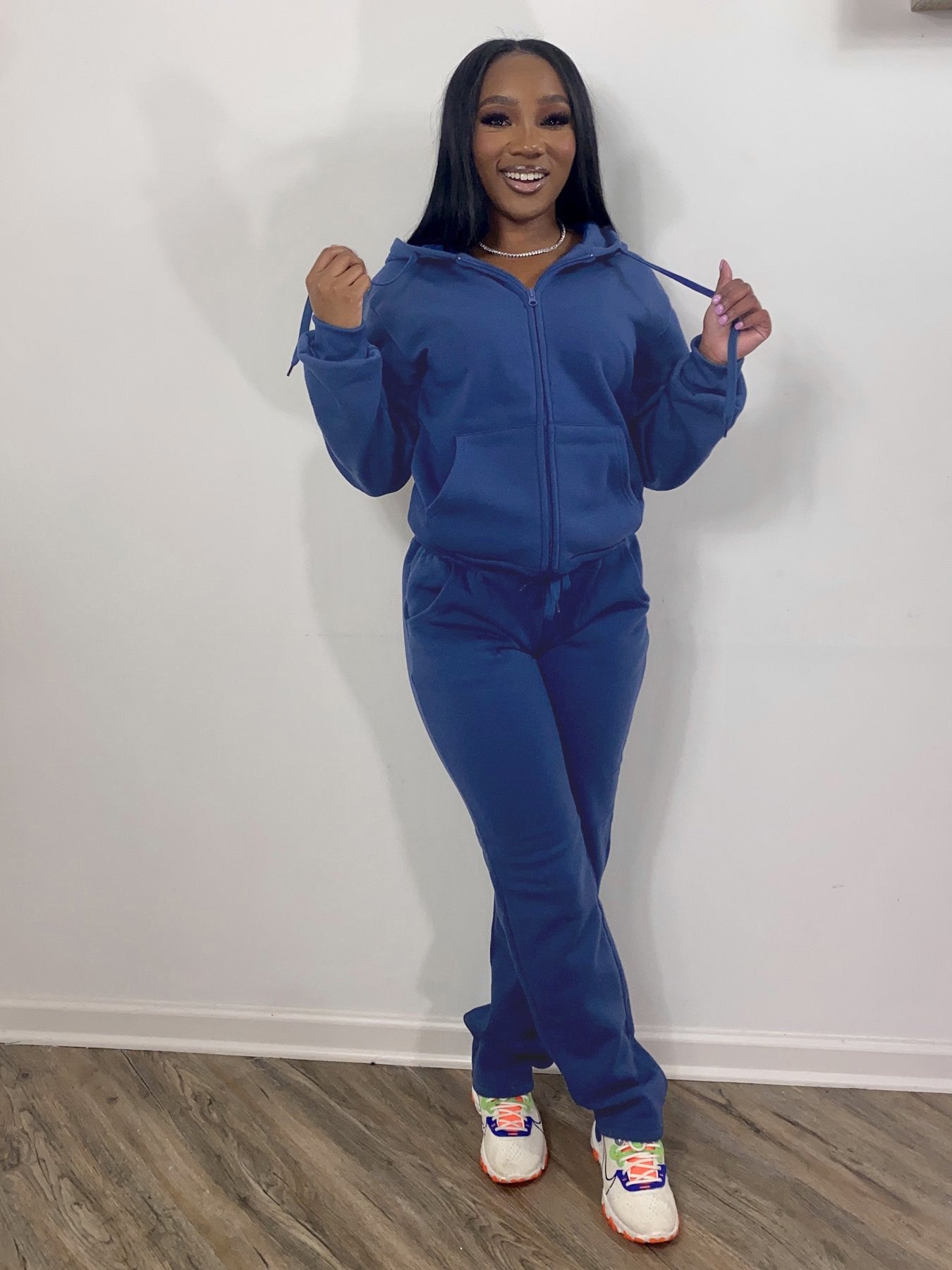 Women sweatsuit set with casual hoodies and jogger sweatpants in red, gray, black, and blue colors