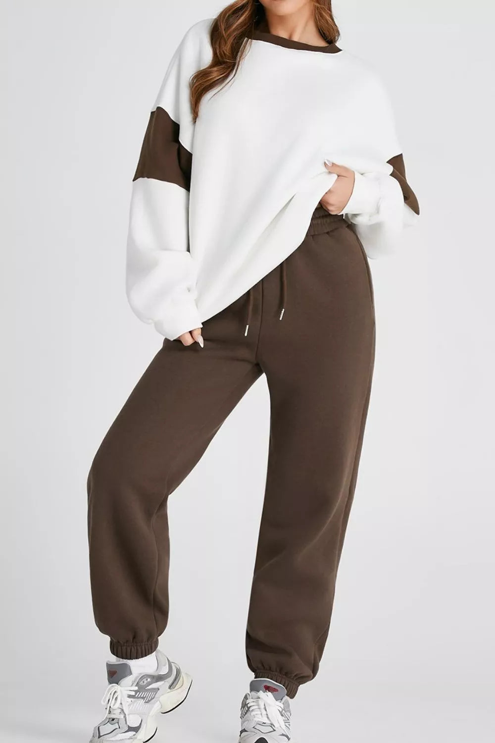 Image of a model wearing the MotionFlex Sweatshirt & Jogger Set, showcasing its relaxed fit and modern athletic style.