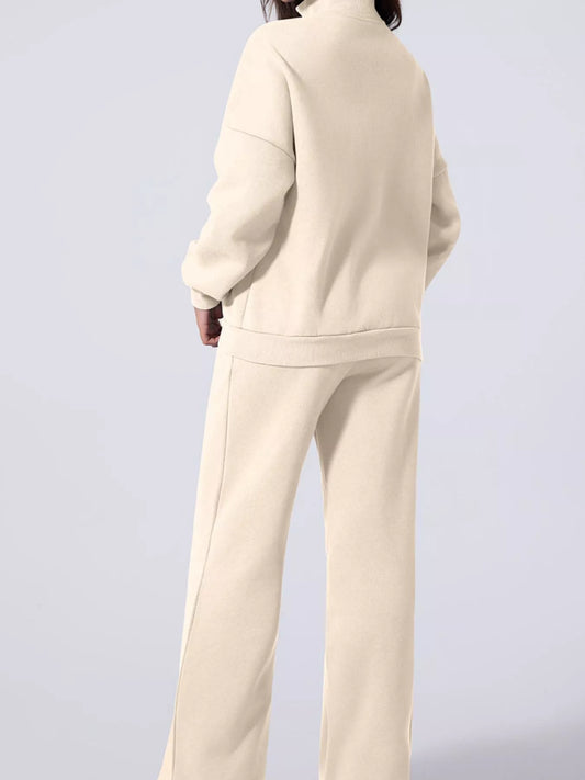 Back view of a person wearing the MotionCore Zip-Up Active Set in neutral color, showcasing comfort and modern style.