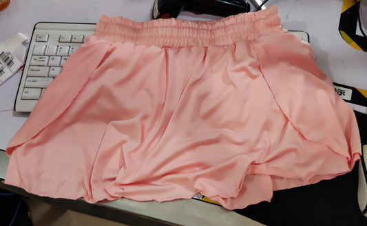 Women wearing colorful scrunch-skirt cycling biker shorts for gym workout and running