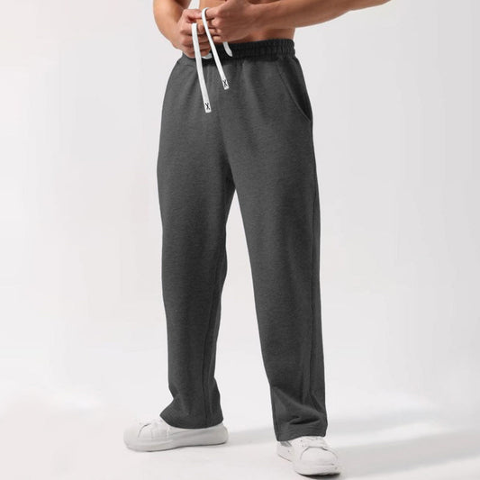Women wearing loose fit, wide-leg elastic-waist drawstring sweatpants in multiple colors for casual street fashion