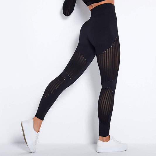 Black high waist hip lift yoga pants with mesh detailing.