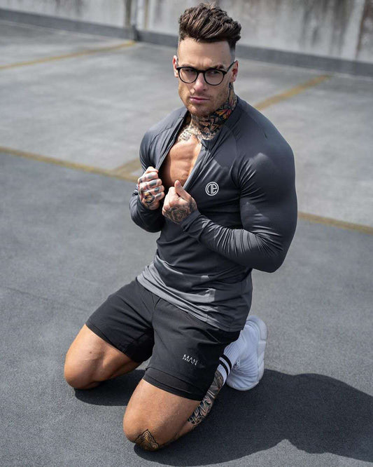 Black men's zipper neck fitness shirt with long sleeves for gym and sports