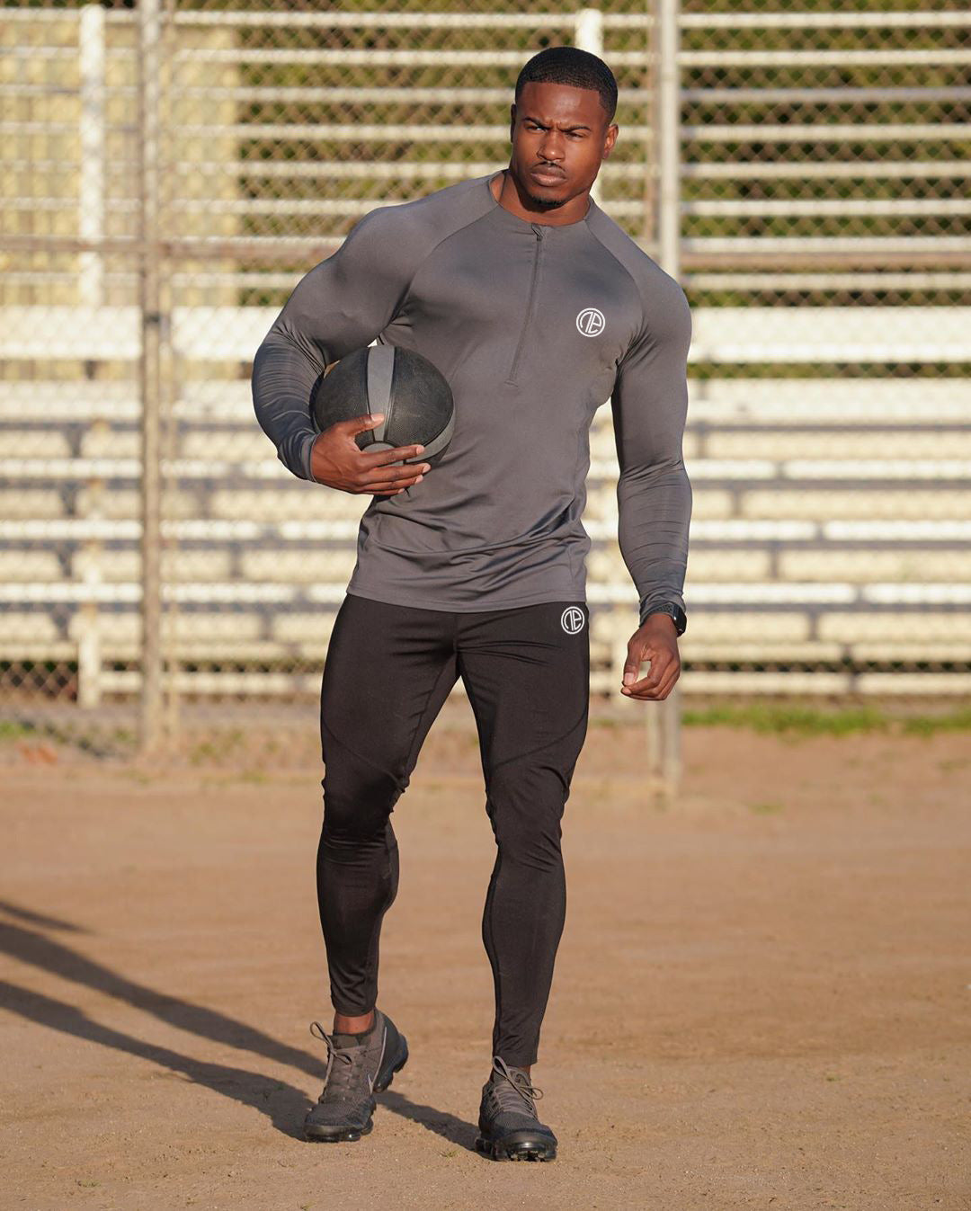 Black long sleeve men's zipper neck fitness shirt for gym and sports