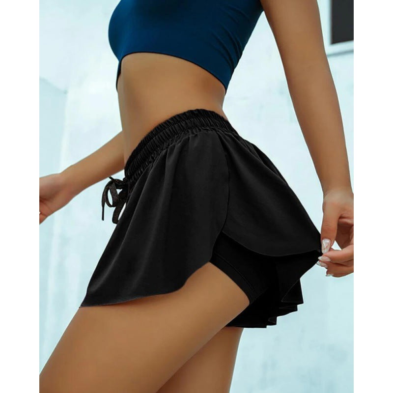 Women wearing colorful scrunch-skirt cycling biker shorts for gym workout and running