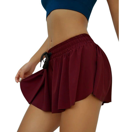Women wearing colorful scrunch-skirt cycling biker shorts for gym workout and running