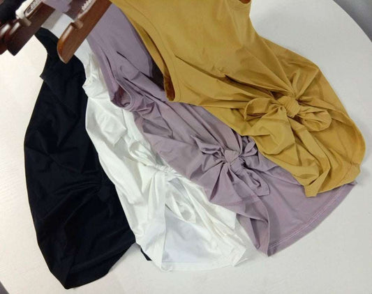 Women wearing colorful yoga top sports shirts and workout tanks in various sizes and colors