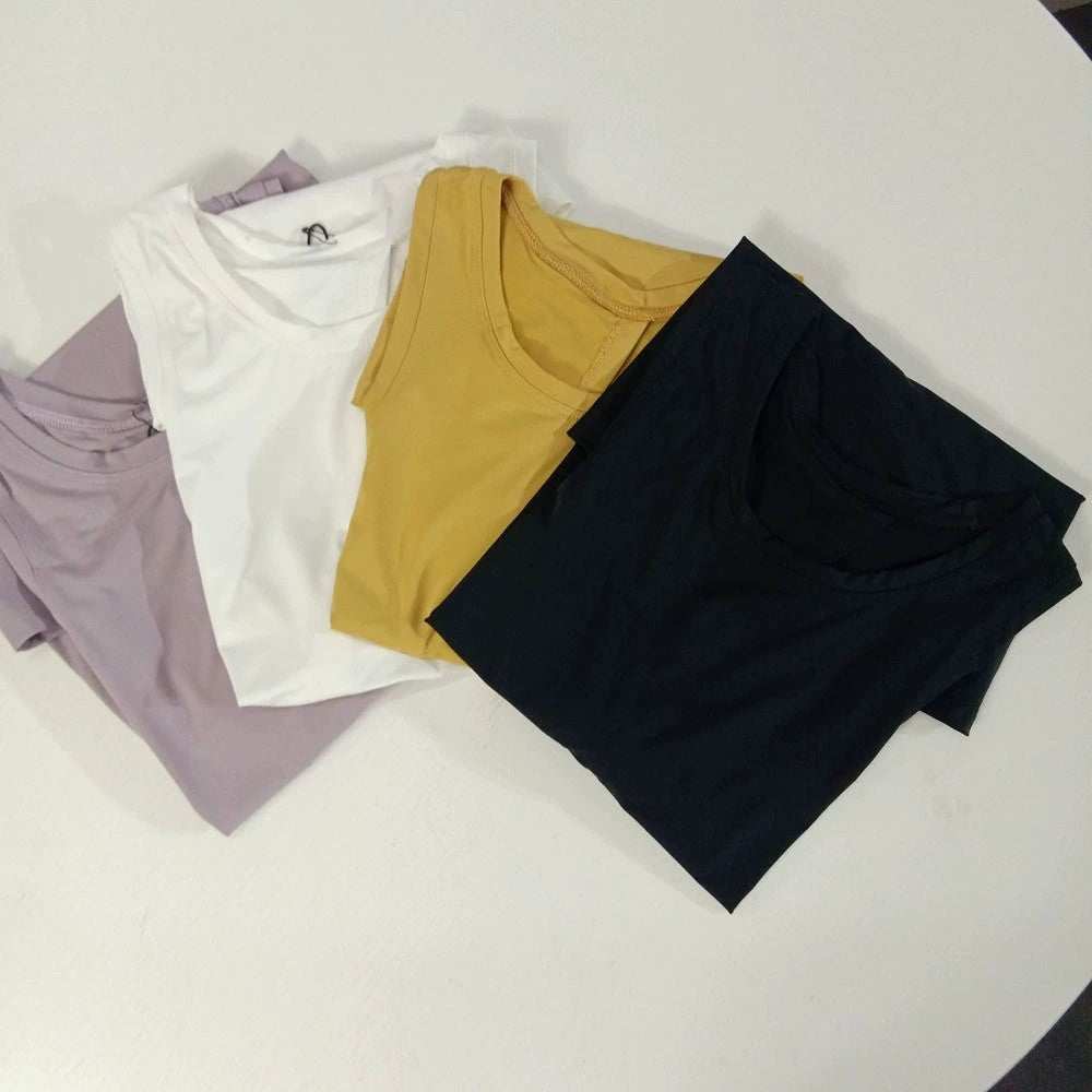 Women wearing loose Yoga Top Sports Shirt in multiple colors for workout and yoga sessions