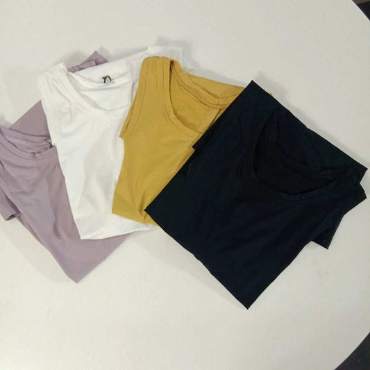 Women wearing loose Yoga Top Sports Shirt in multiple colors for workout and yoga sessions