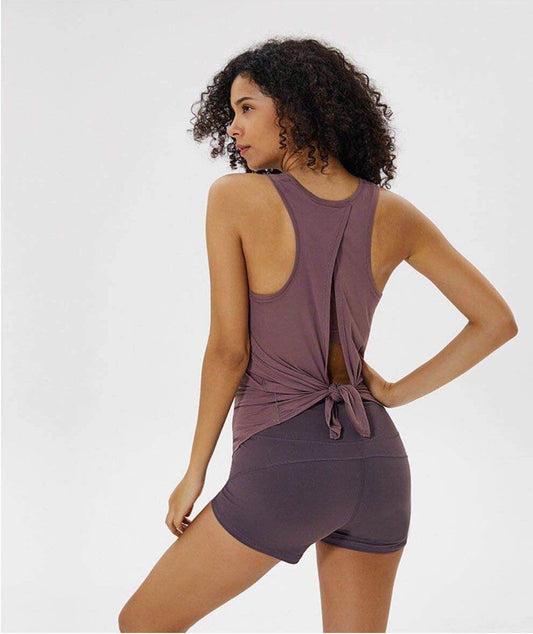 Women wearing yoga top sports shirts in various colors for workout and casual wear.