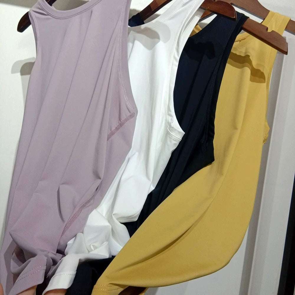 Women wearing loose yoga top sports shirts in various colors and sizes for workouts