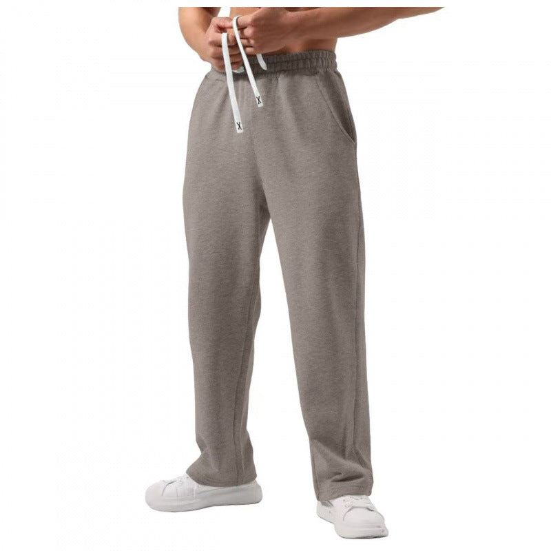 Male solid color elastic-waist drawstring sweatpants in multiple colors and loose fit style