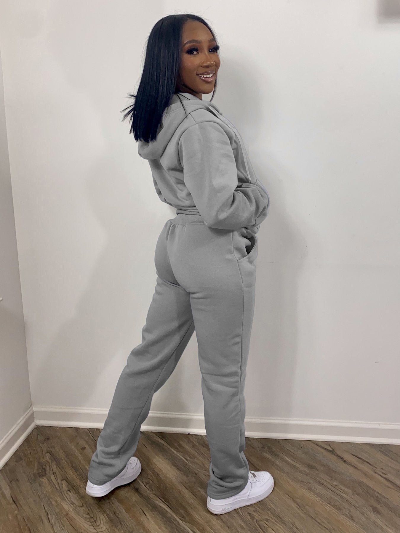 Women wearing casual athletic women sweatsuit set with hoodies and jogger sweatpants in multiple solid colors