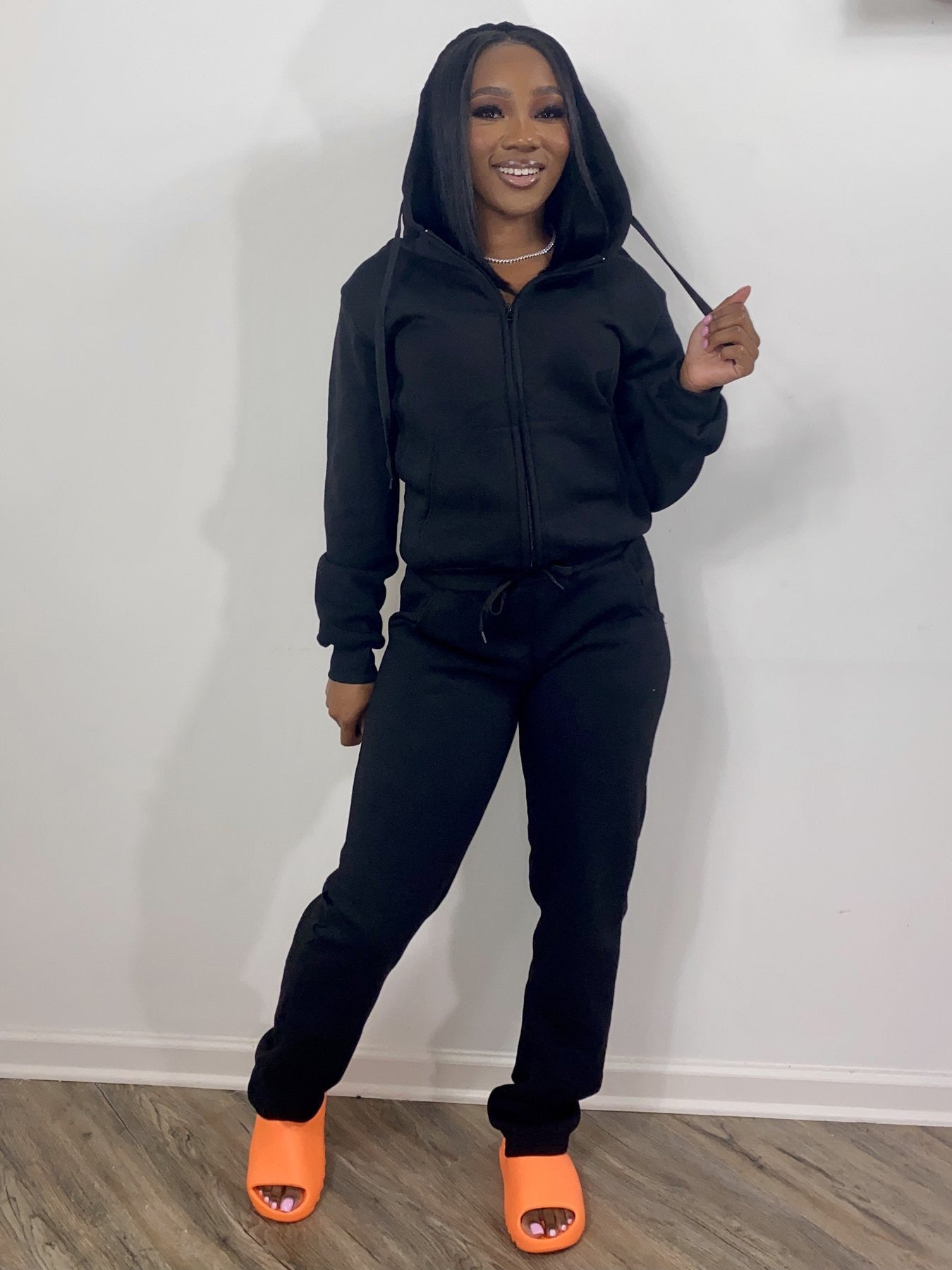 Women wearing casual women sweatsuit set with hoodies and sweatpants in multiple colors