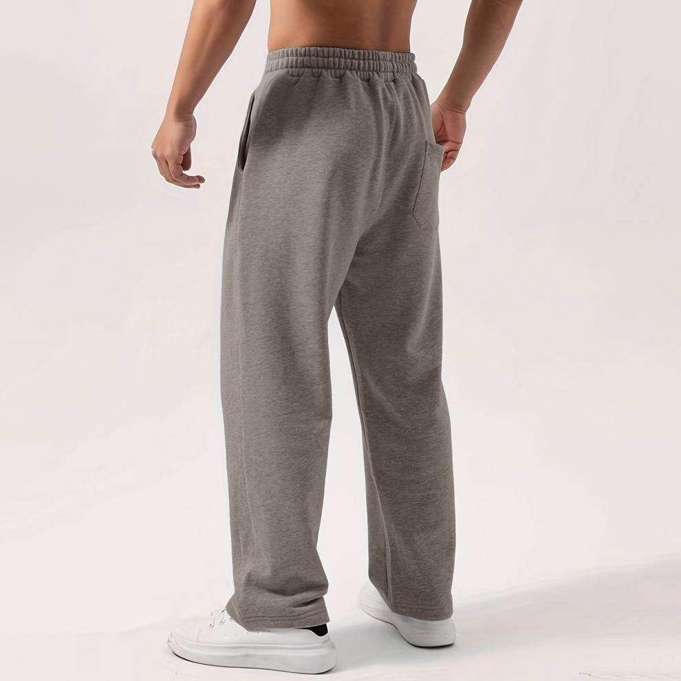 Male elastic-waist drawstring sweatpants in multiple colors with loose wide-leg fit and natural waist.