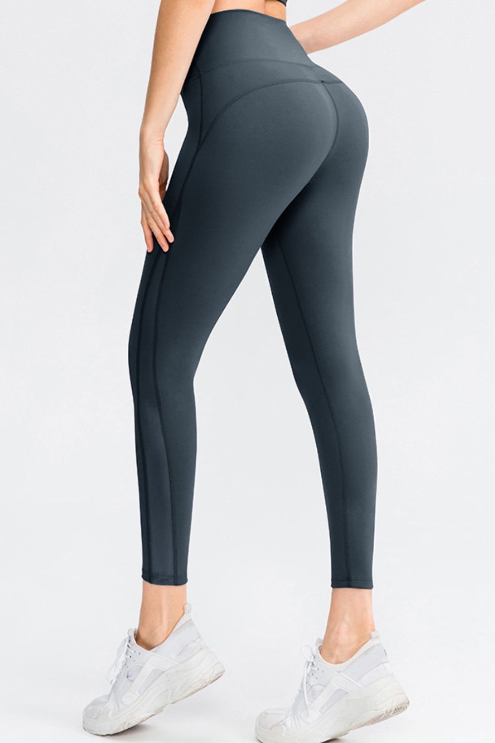 CoreLift Wide-Waist Performance Leggings showcasing a woman from behind, highlighting a flattering fit and style.
