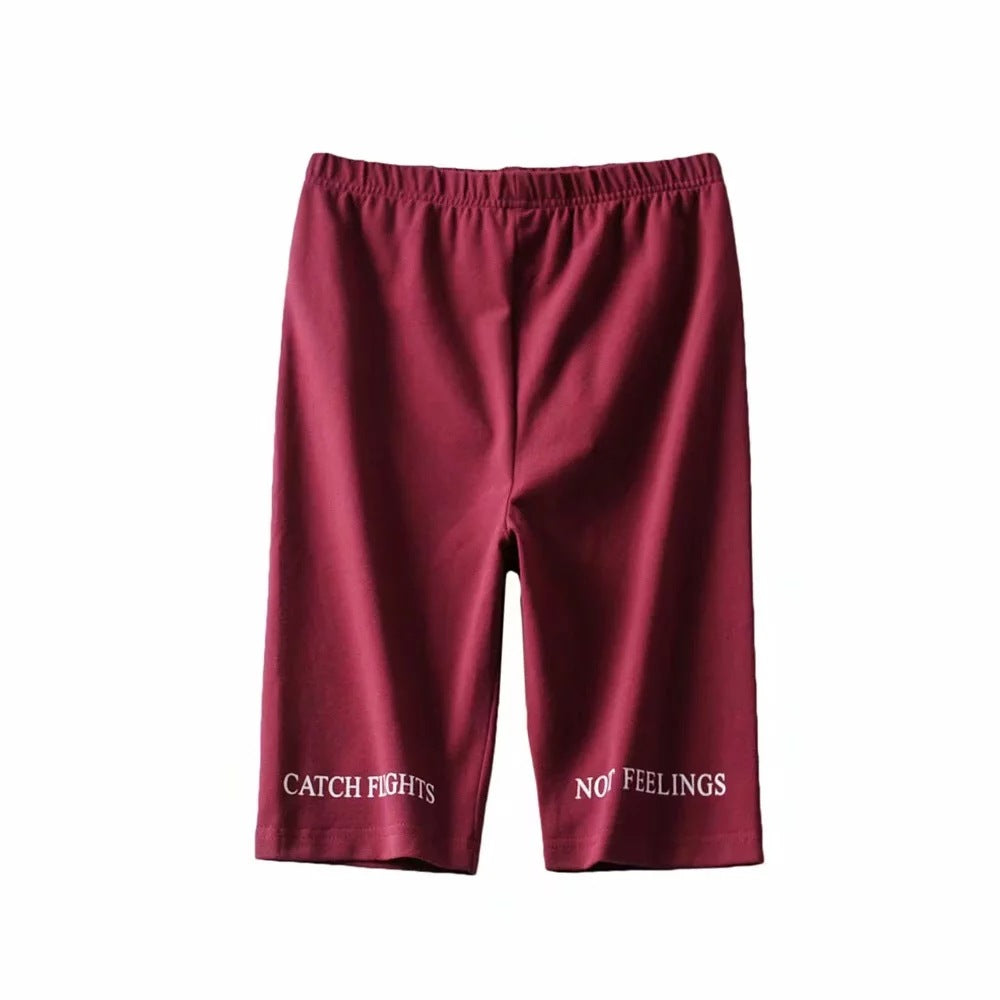 AlphaFlex maroon training shorts featuring "CATCH FIGHTS" and "NO FEELINGS" text for performance workouts.