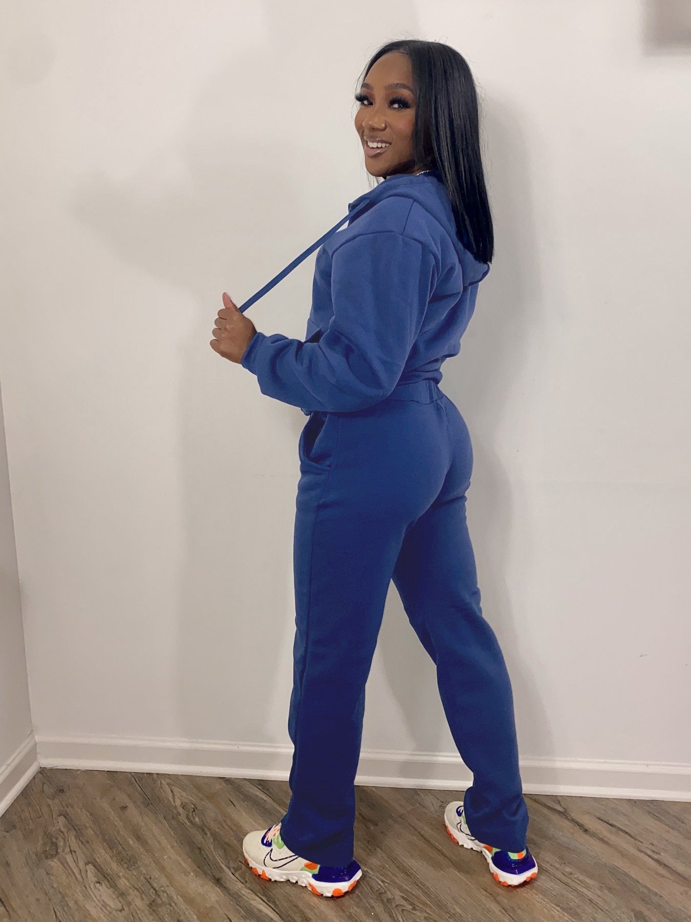 Women wearing casual two-piece women sweatsuit set with hoodies and jogger sweatpants in various colors