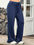Front view of navy blue wide leg active pants with drawstring
