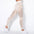 Beige high waist yoga pants featuring stylish stripes.