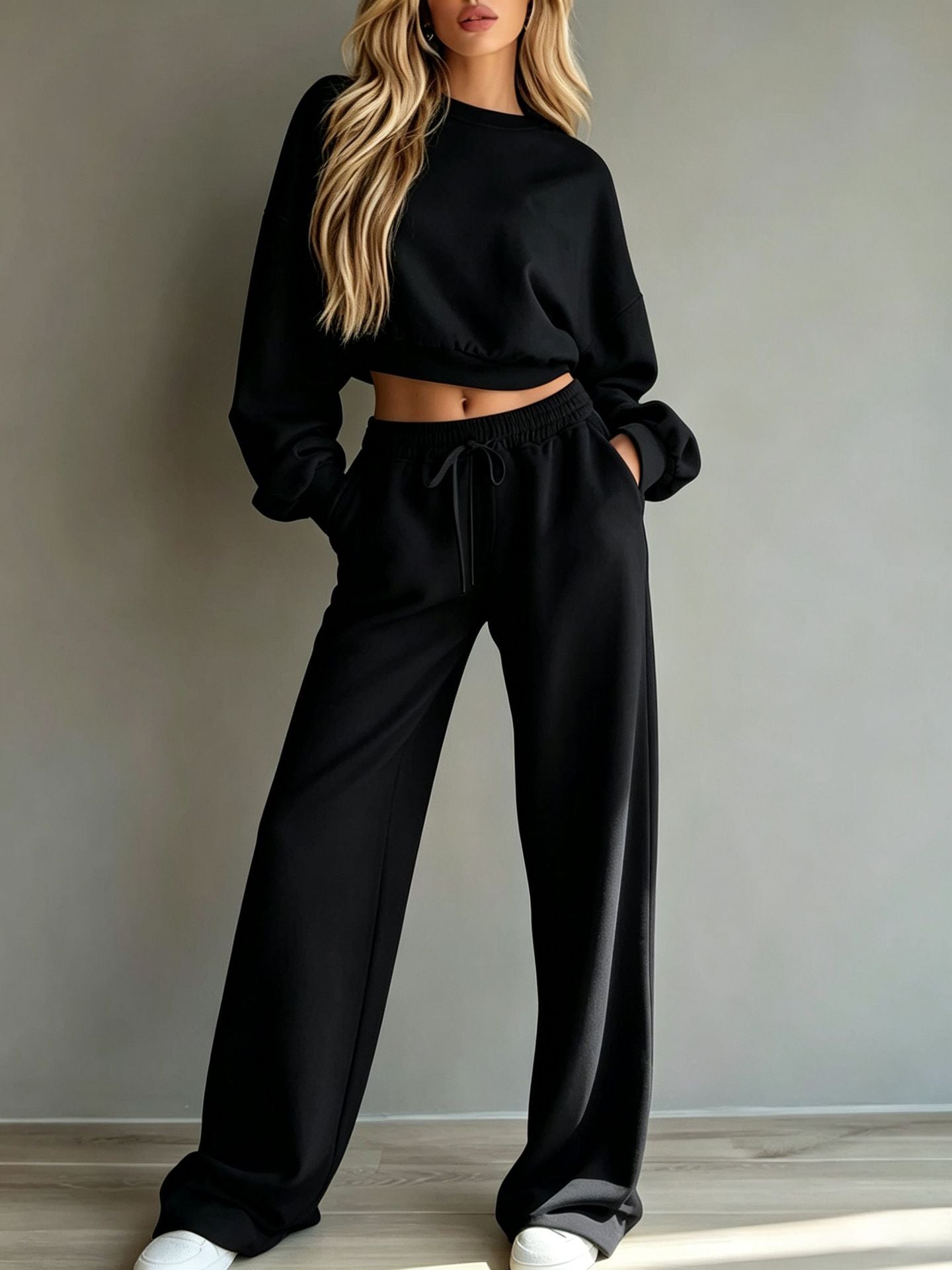 Woman wearing light yellow casual short hooded sweatshirt and wide-leg pants set for sports
