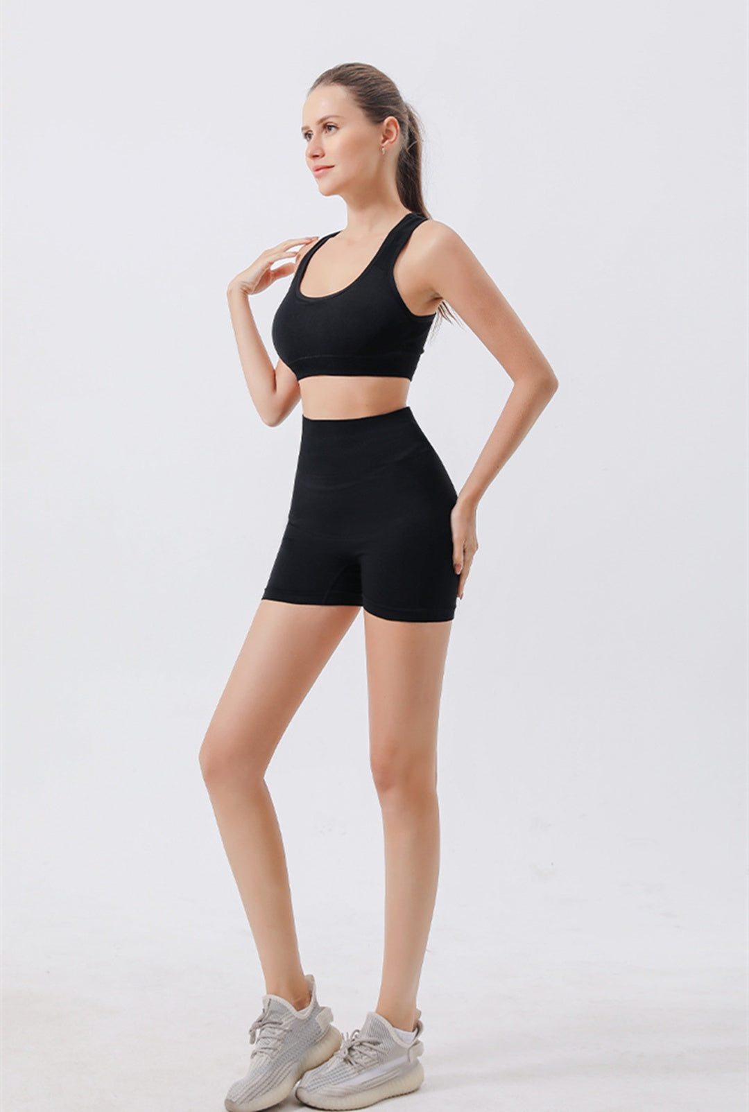 Women wearing 2-piece seamless ribbed crop tank and high waist shorts workout set for yoga and fitness