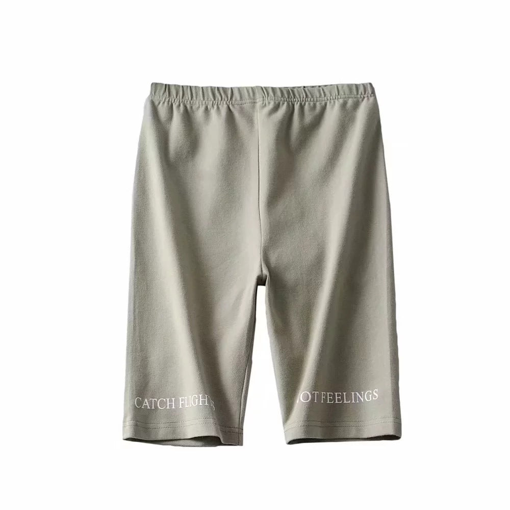 AlphaFlex Performance Training Shorts in light gray with unique text design on the fabric.