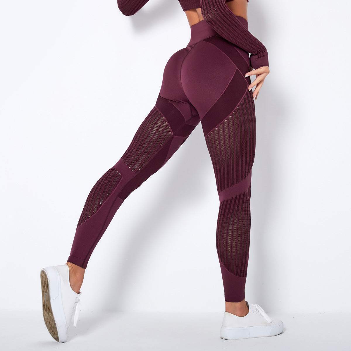 Woman wearing high waist hip lift yoga pants with quick drying and stretchy fabric features