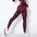 Woman wearing high waist hip lift yoga pants with quick drying and stretchy fabric features