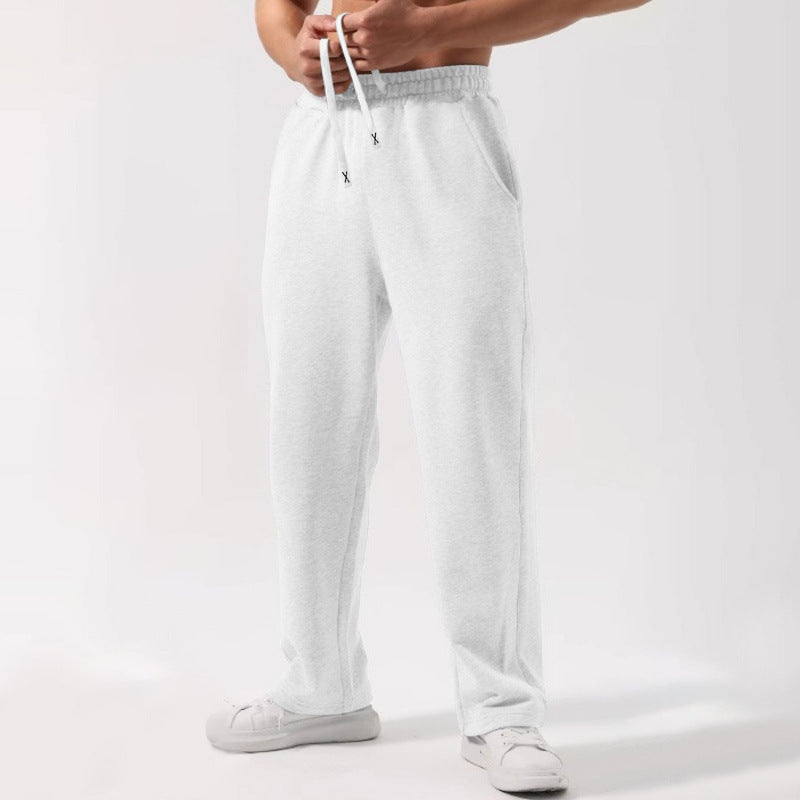 Male elastic-waist drawstring sweatpants in solid color with loose fit and wide-leg style