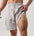 Men wearing fitness breathable ice silk shorts in various colors for sports and leisure