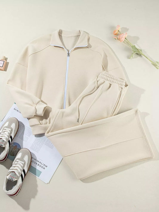 MotionCore Zip-Up Active Set in beige, featuring a zip-up jacket and matching pants, perfect for workouts and everyday wear.