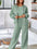 Woman wearing MotionCore Zip-Up Active Set in soft green, perfect for workouts and everyday movement.