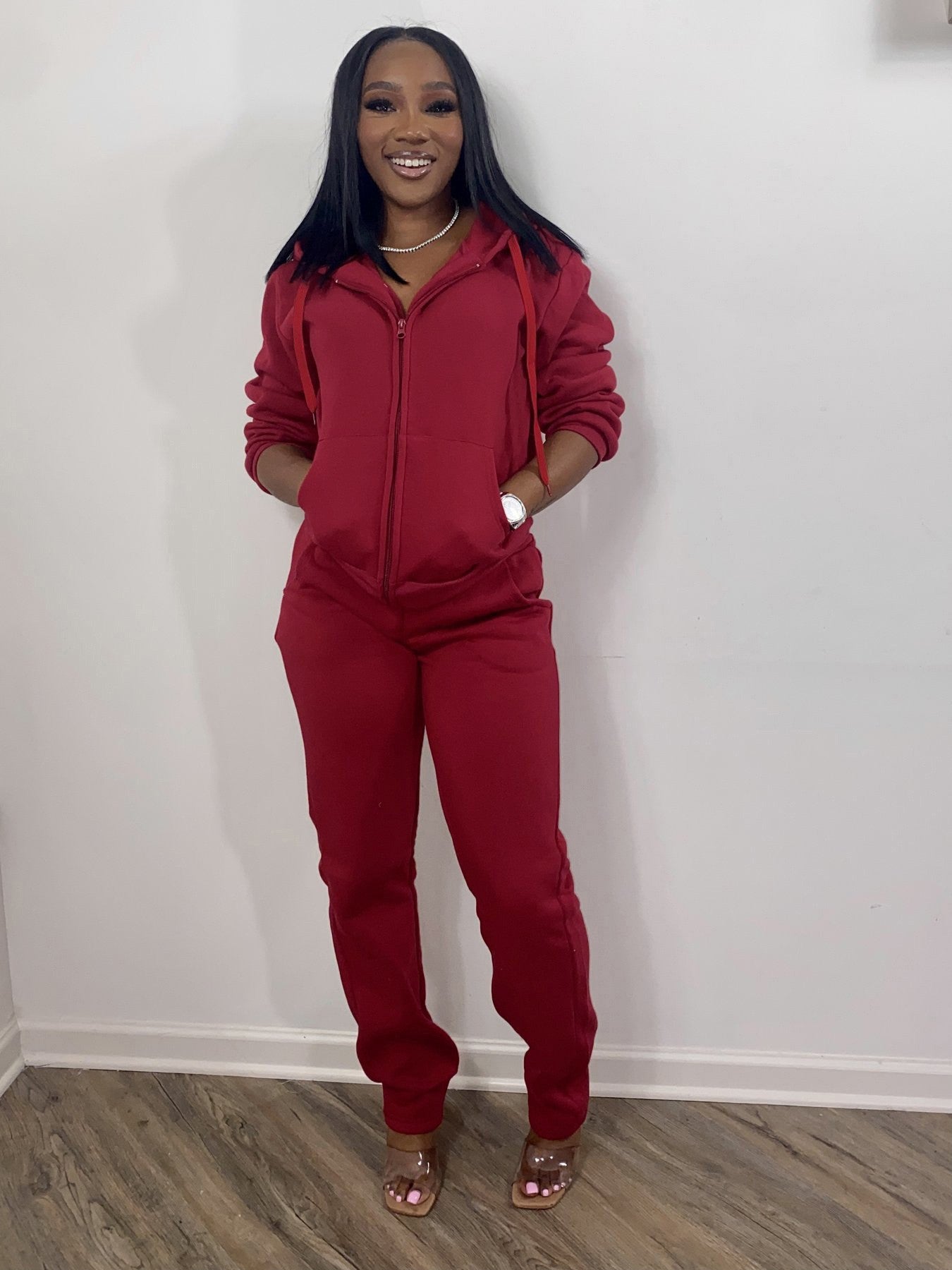 Women wearing casual athletic women sweatsuit set with hoodies and jogger sweatpants in various colors