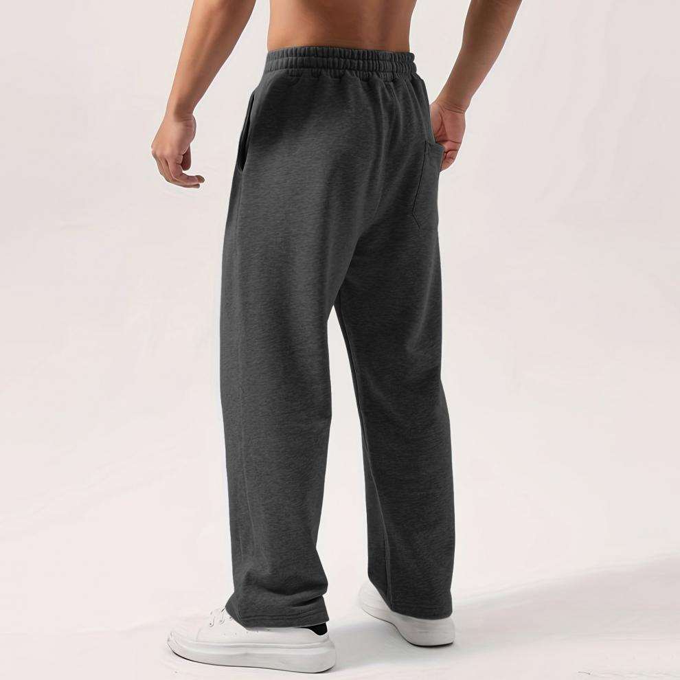 Male elastic-waist drawstring sweatpants in solid colors with loose fit and wide-leg style