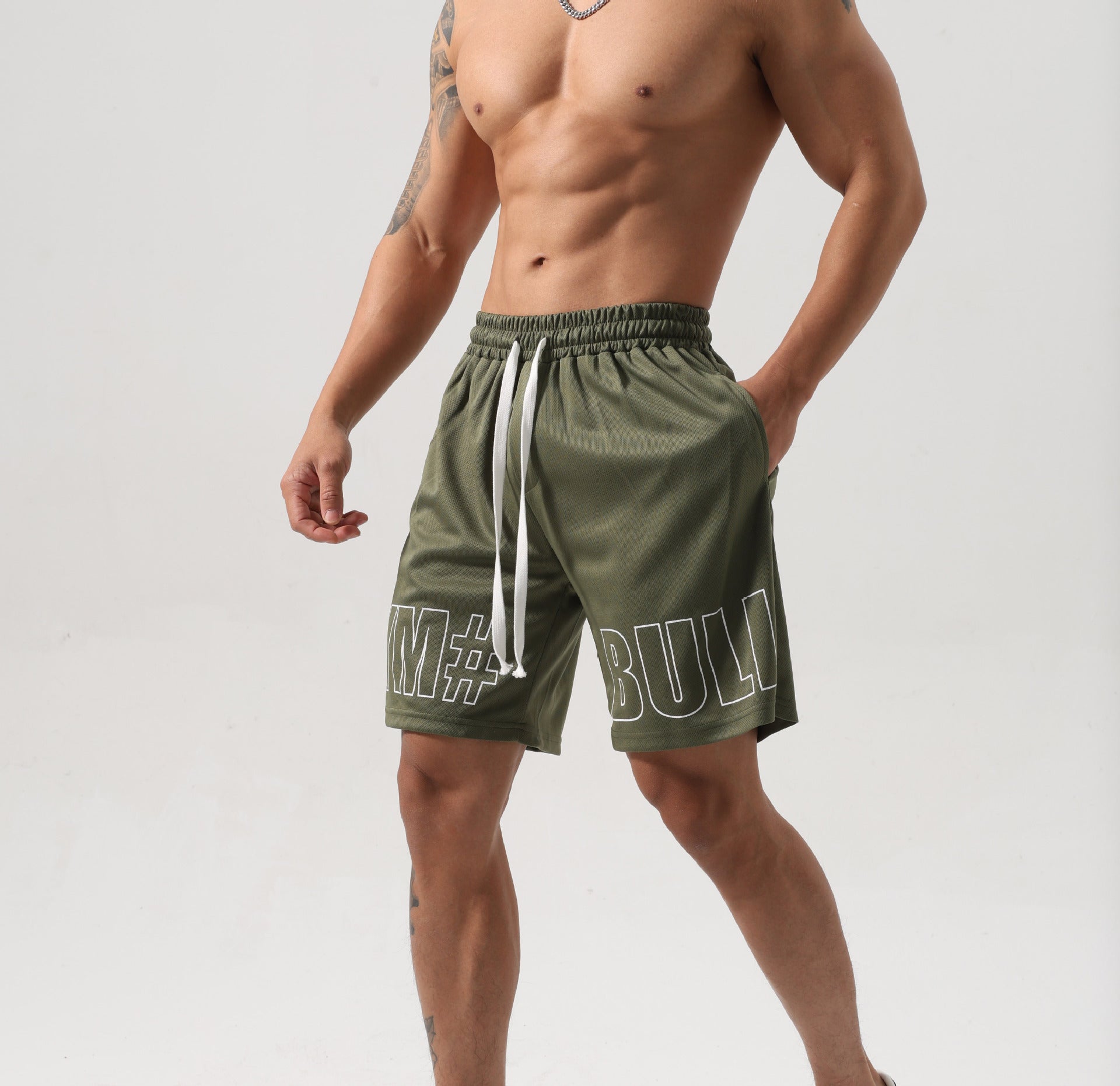 Men wearing fitness breathable ice silk shorts in black and gray colors for sports and leisure