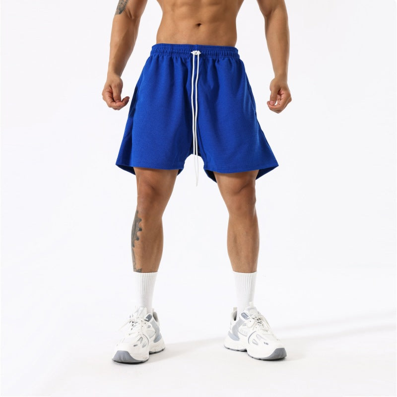 Men's fashion breathable workout shorts in blue, beige, grey, and black with moisture-wicking polyester fabric and mid-waist design.