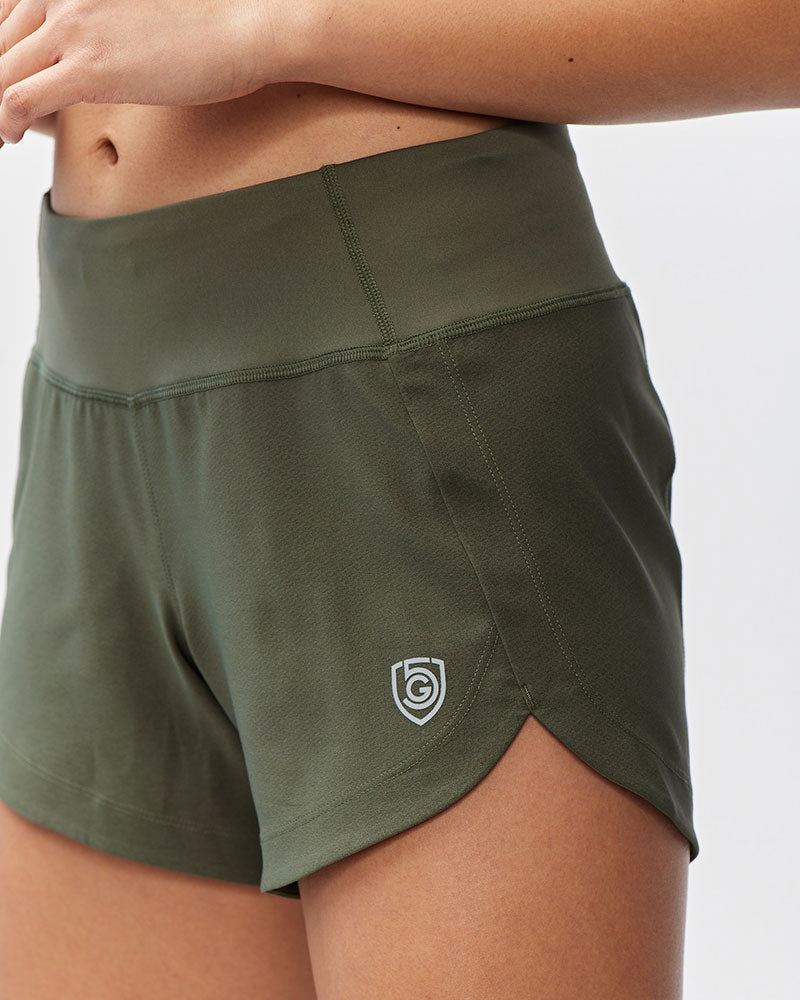 Excel Sculpt Performance Shorts in olive green, featuring a comfortable high waistband and sleek design for confident movement.