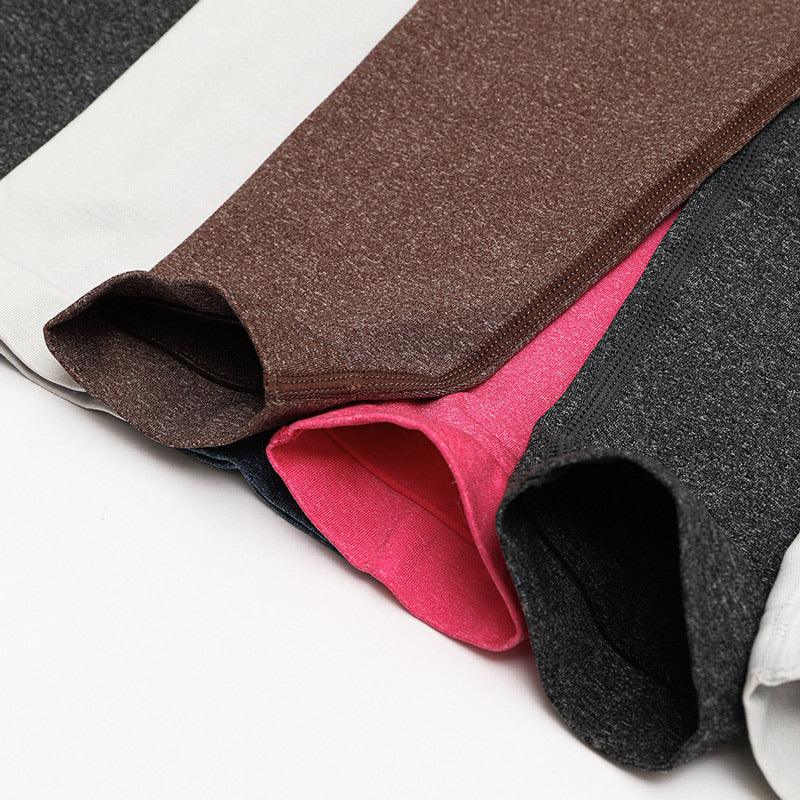 SculptFlex Seamless high-waist performance leggings in various colors stacked together.