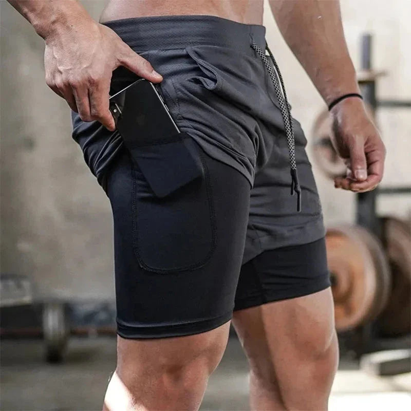 StealthFlex 2-in-1 Performance Training Shorts with pocket shown in gym environment.
