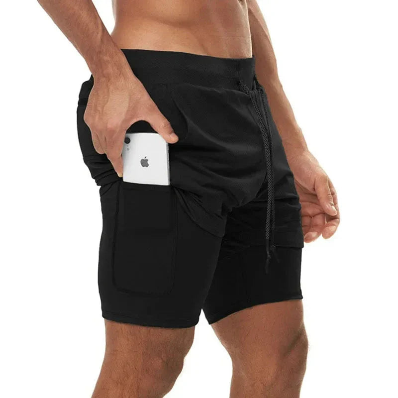 Close-up of a man wearing StealthFlex 2-in-1 Performance Training Shorts, showcasing a phone in the pocket.