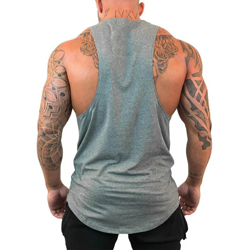 Back view of a muscular man wearing a FlexFit Cotton Performance Tank illustrating comfort and mobility.