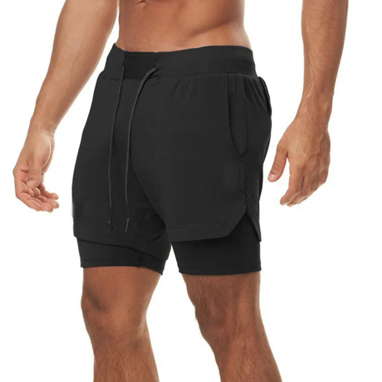 Man wearing StealthFlex 2-in-1 Performance Training Shorts in black, showcasing flexibility and comfort during workouts.
