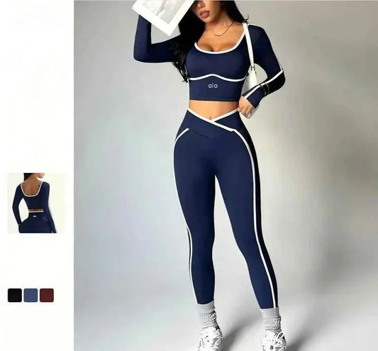 Woman wearing 2026 Colorblock V-Waist Yoga Set with long-sleeve top and high-rise V-waist leggings in a colorblocked design.