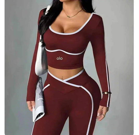 Woman wearing 2026 Colorblock V-Waist Yoga Set with long-sleeve top and high-rise leggings in colorblock design.