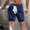 Men's Double-Layer Quick-Drying Breathable Jogging Shorts showcased from behind, featuring a towel and athletic appeal.