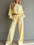 Womens casual short hooded sweatshirt and wide-leg pants set in light yellow polyester fabric