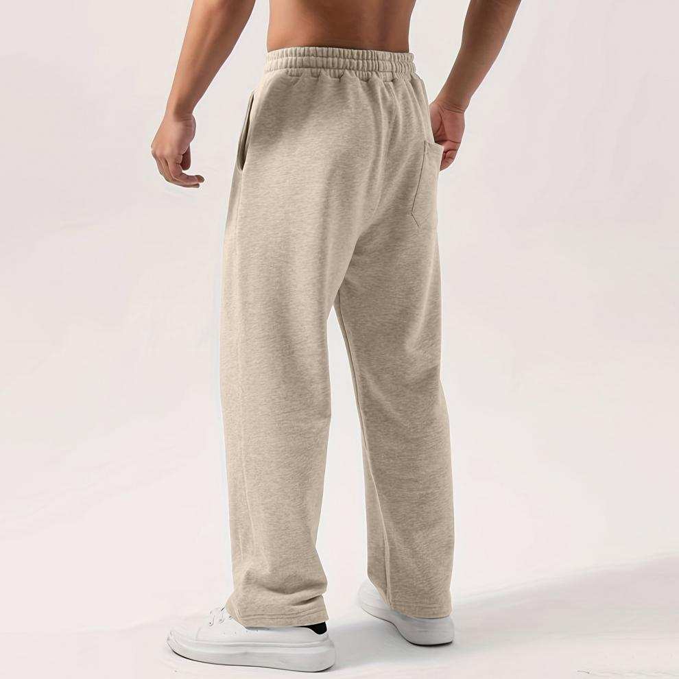 Male elastic-waist drawstring sweatpants in solid colors with loose fit and wide-leg style