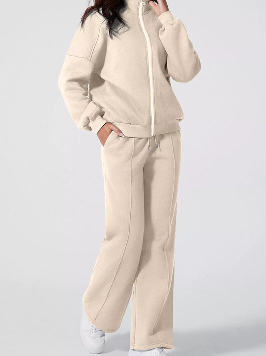 Model wearing MotionCore Zip-Up Active Set, a beige coordinated activewear set for workouts and everyday activities.