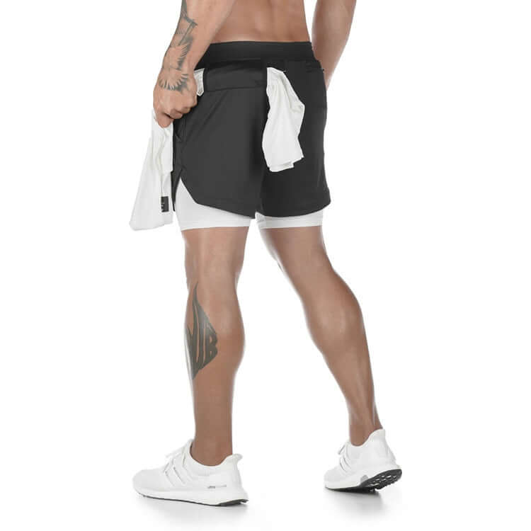 Men's quick-dry jogging shorts showcased on a male model, demonstrating comfort and performance in a sporty setting.